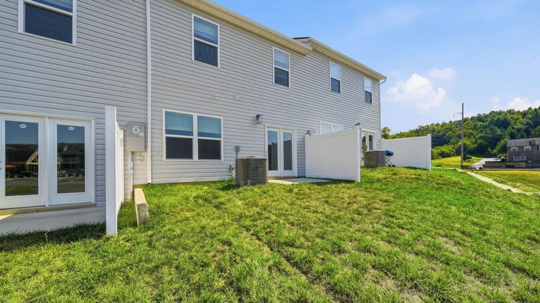 Exterior details and patio area of a home in The Arbor Townhomes, Kingsport (Image 14).