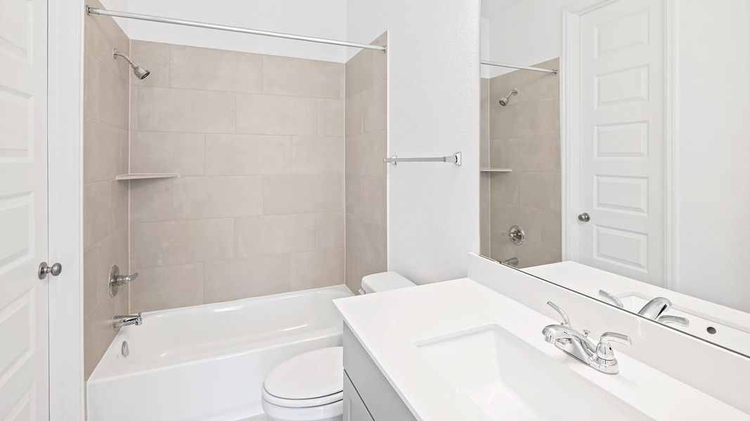 Bathroom featuring bathing tub / shower combination and vanity