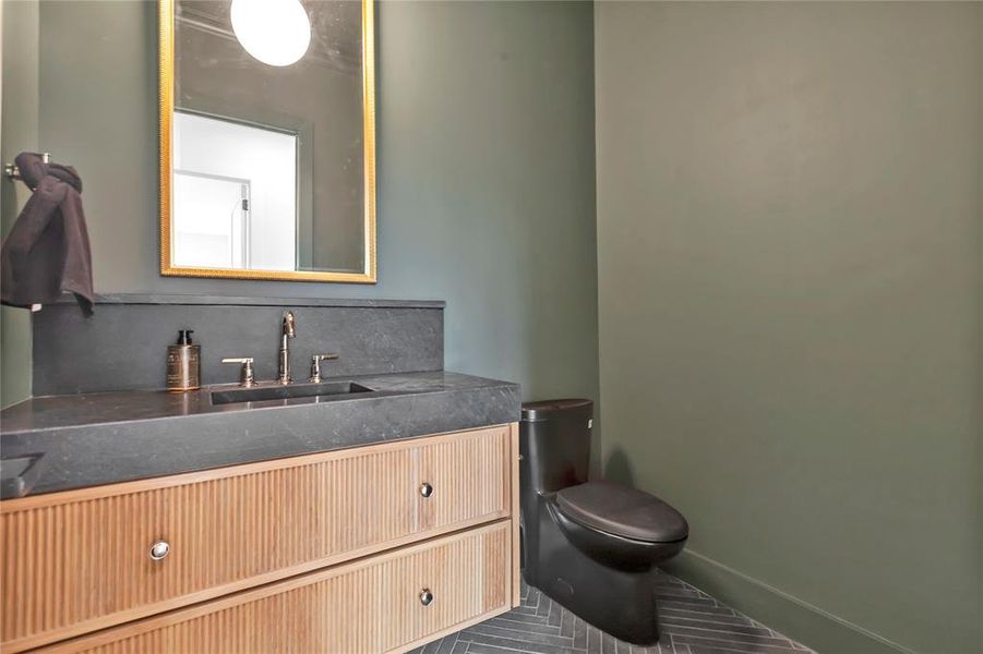 Half bath with toilet and vanity Half bath with toilet and vanity