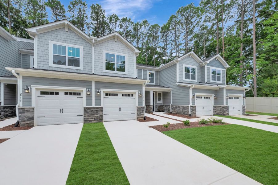 Front exterior of a new home in Ashmore Townes, Garner, NC, highlighting curb appeal (Image 2). Front exterior of a new home in Ashmore Townes, Garner, NC, highlighting curb appeal (Image 2).
