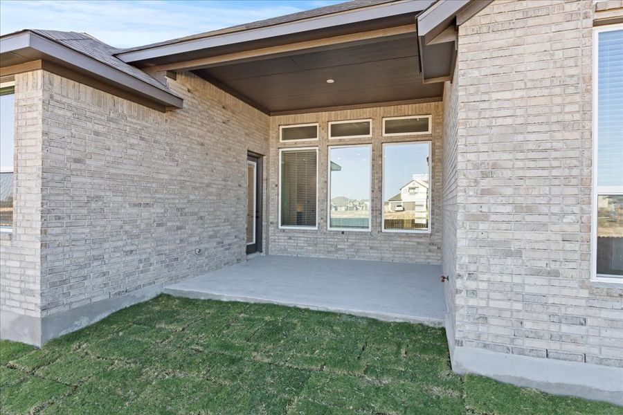 Exterior details and patio area of a home in Village at Three Oaks, Seguin (Image 21). Exterior details and patio area of a home in Village at Three Oaks, Seguin (Image 21).