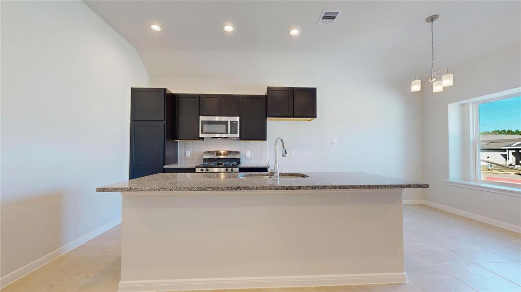 Furnished interior view inside a new home in East Gate Villas, Willis (Image 5).