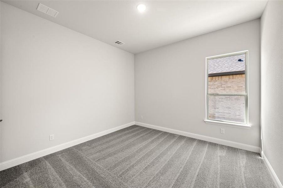 Spare room with carpet flooring