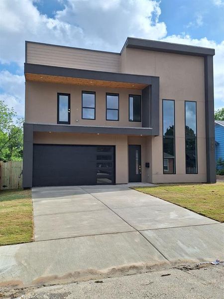 Front exterior of a new home in , Dallas, TX, highlighting curb appeal (Image 1). Front exterior of a new home in , Dallas, TX, highlighting curb appeal (Image 1).