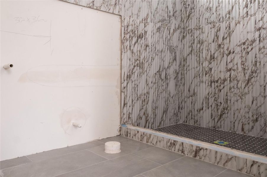 Secondary Bathroom tile on Unit B/C. Progress as of 4/15/26.