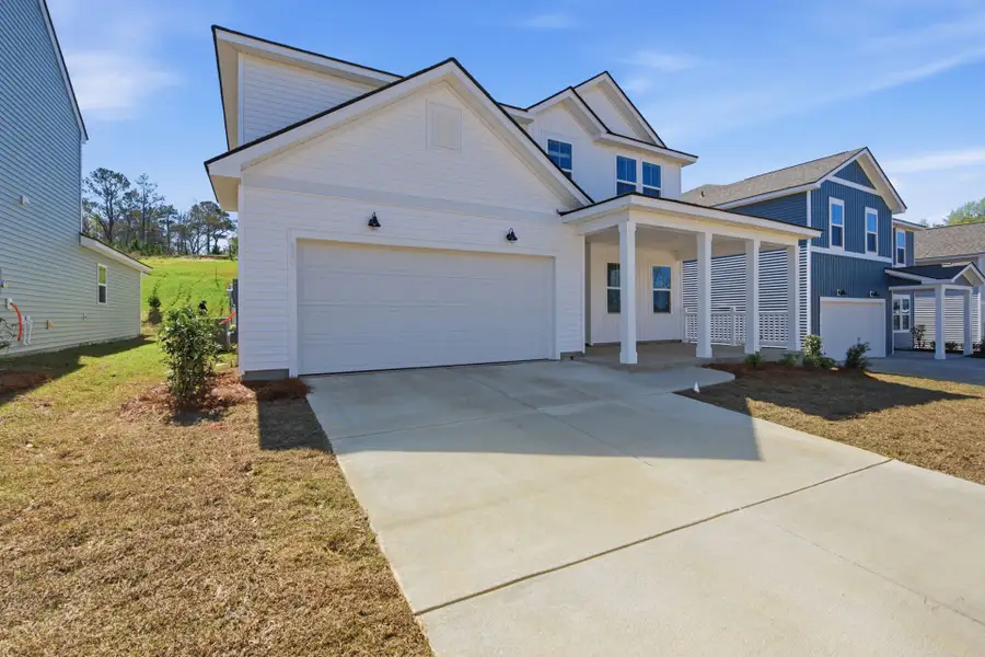 Front exterior of a new home in Grand Arbor, Blythewood, SC, highlighting curb appeal (Image 2). Front exterior of a new home in Grand Arbor, Blythewood, SC, highlighting curb appeal (Image 2).