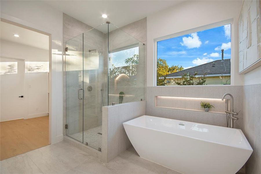 Full bathroom with a soaking tub, a stall shower, tile patterned flooring, and recessed lighting