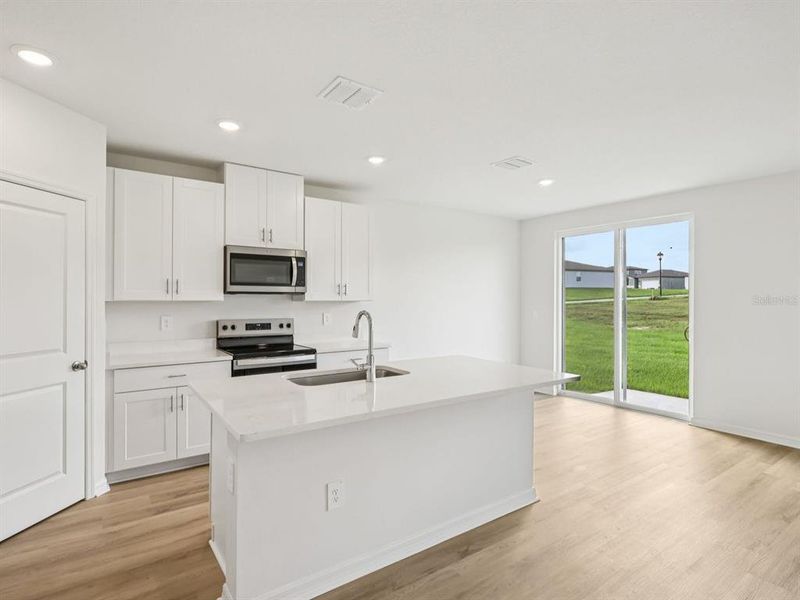 Furnished interior view inside a new home in The Reserve at Van Oaks, Auburndale (Image 6).