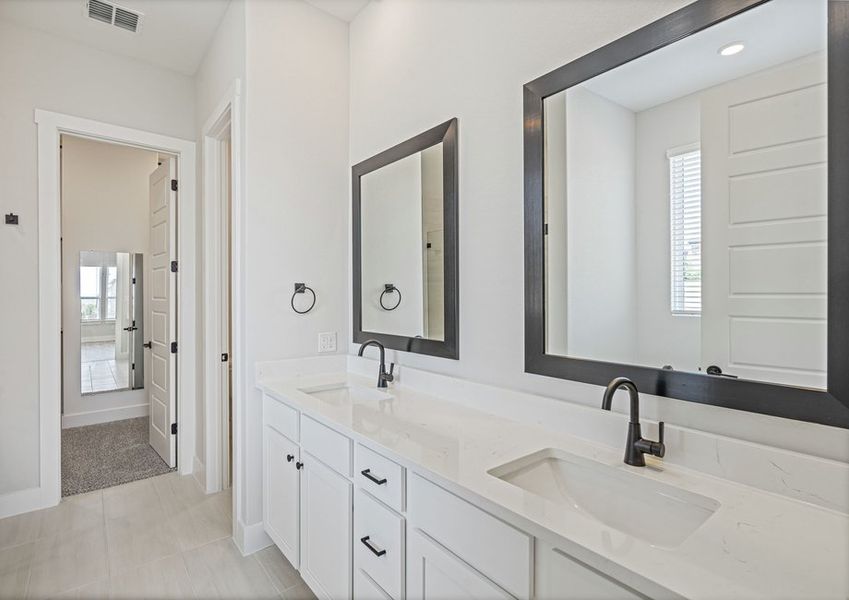 The master bathroom has a sprawling dual-sink vanity.