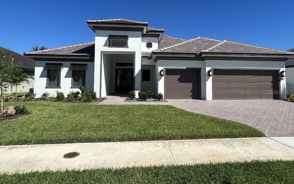 Front exterior of a new home in , Auburndale, FL, highlighting curb appeal (Image 11). Front exterior of a new home in , Auburndale, FL, highlighting curb appeal (Image 11).