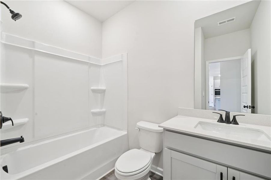 Furnished interior view inside a new home in Vines at Mill Creek - Estate Series, Braselton (Image 4).