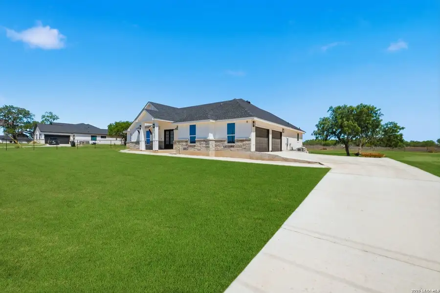 Exterior details and patio area of a home in , Floresville (Image 4).