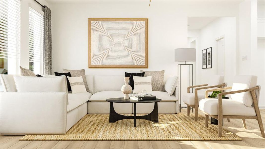 This inviting living area features hardwood floors and a woven area rug This inviting living area features hardwood floors and a woven area rug