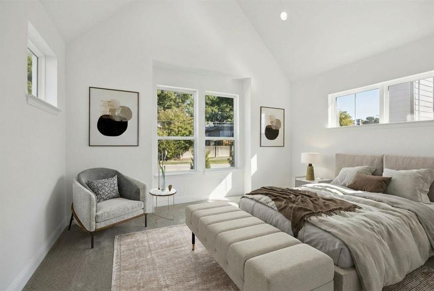 Carpeted bedroom with lofted ceiling, multiple windows, and recessed lighting Carpeted bedroom with lofted ceiling, multiple windows, and recessed lighting