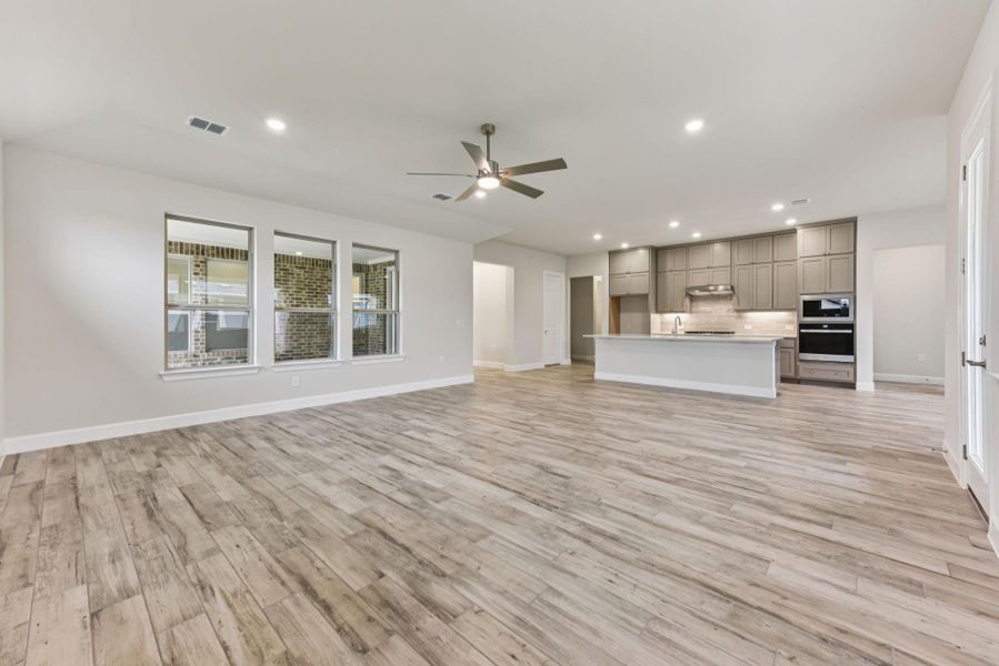 Unfurnished living room featuring recessed lighting, light wood-type flooring, and ceiling fan
