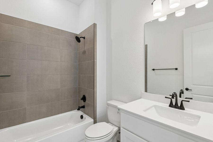 Representative furnished interior of a home built from the Roosevelt by Centre Living Homes in Newman Village Townhomes, Frisco (Image 19).