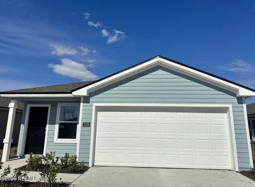 Front exterior of a new home in Rookery, Green Cove Springs, FL, highlighting curb appeal (Image 1). Front exterior of a new home in Rookery, Green Cove Springs, FL, highlighting curb appeal (Image 1).