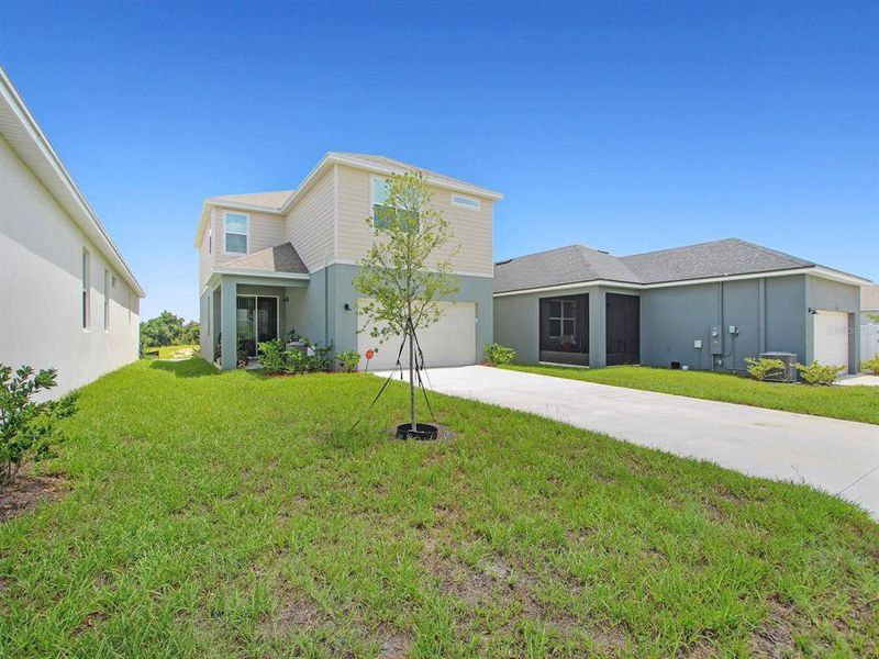 Front exterior of a new home in , Groveland, FL, highlighting curb appeal (Image 25).