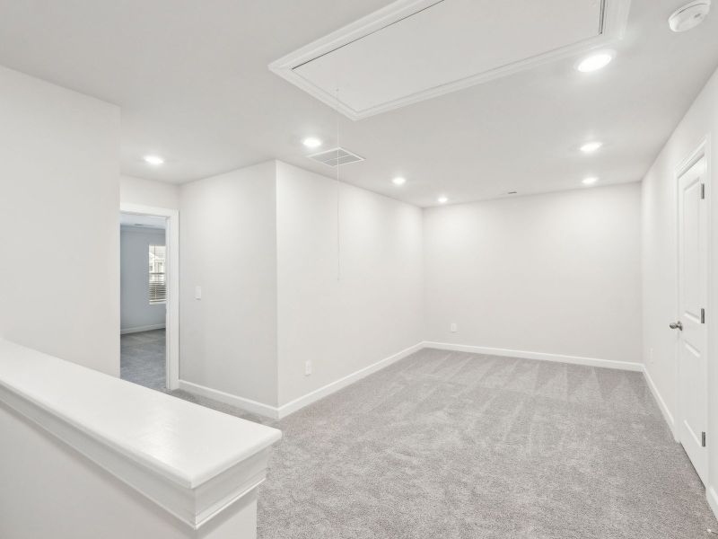 The spacious loft conveniently leads to each upstairs bedroom. The spacious loft conveniently leads to each upstairs bedroom.