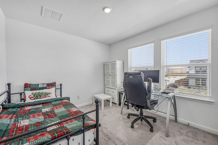 White walls with a recessed light fixture and a ceiling vent White walls with a recessed light fixture and a ceiling vent