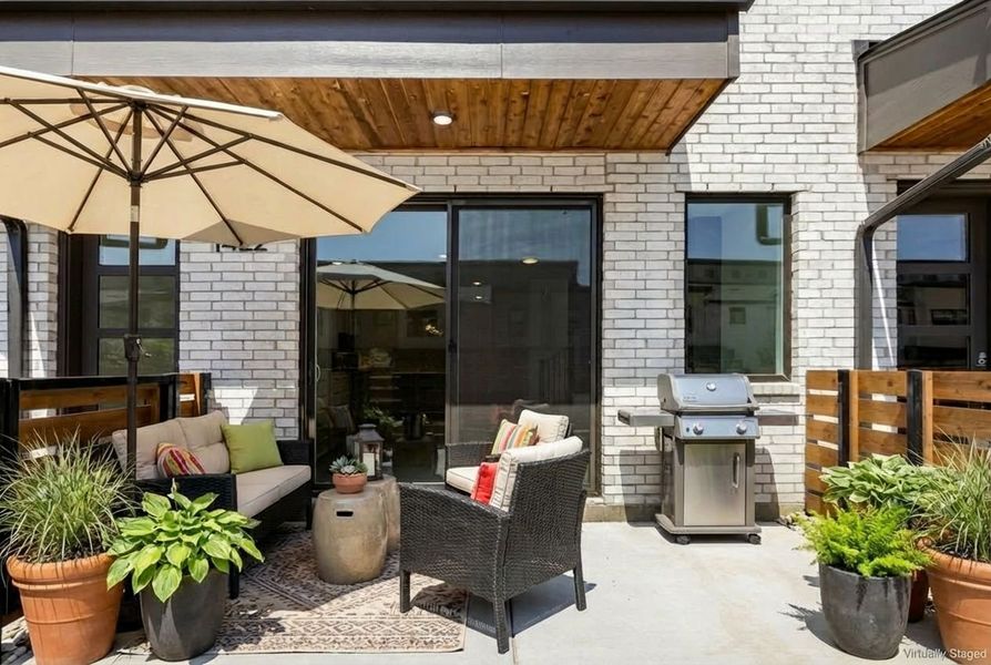 Exterior details and patio area of a home in Willow Grove Townhomes, Melissa (Image 28).