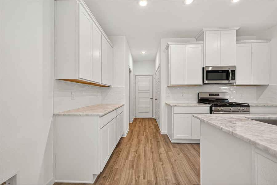 Furnished interior view inside a new home in Mill Creek Trails, Magnolia (Image 10).