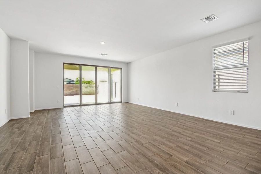 Great room with 4 panel slider. Not actual home, finishes and options may vary. Great room with 4 panel slider. Not actual home, finishes and options may vary.