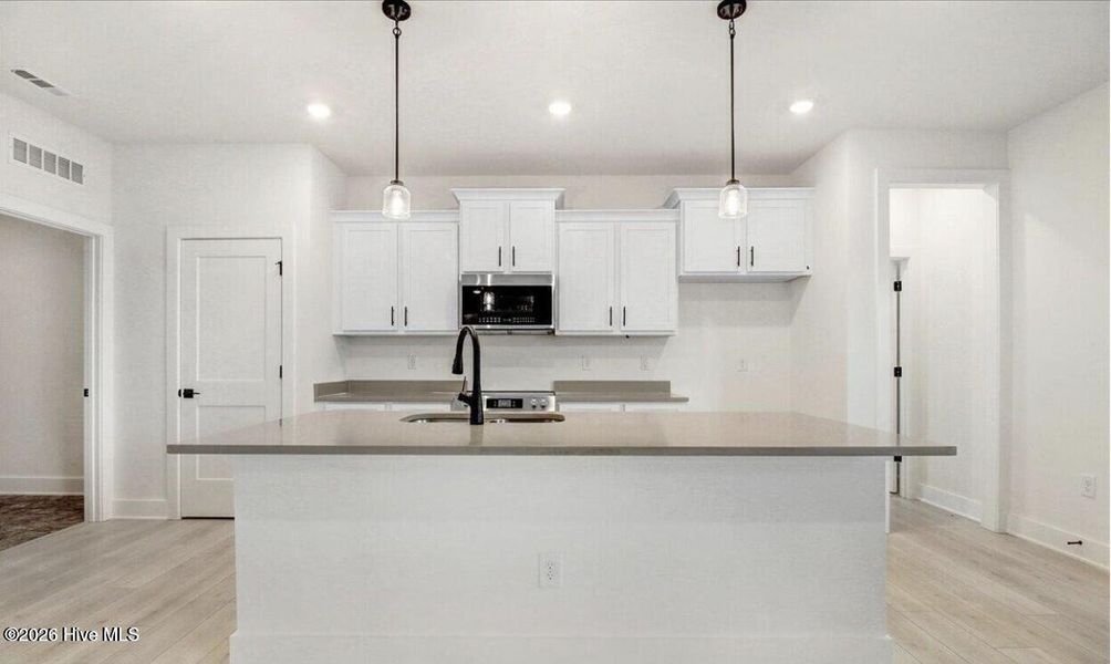 Furnished interior view inside a new home in Wood Creek Landing, Leland (Image 5).