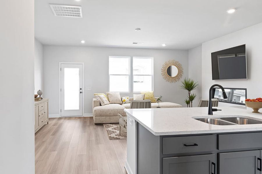 A large kitchen with a large island. A large kitchen with a large island.