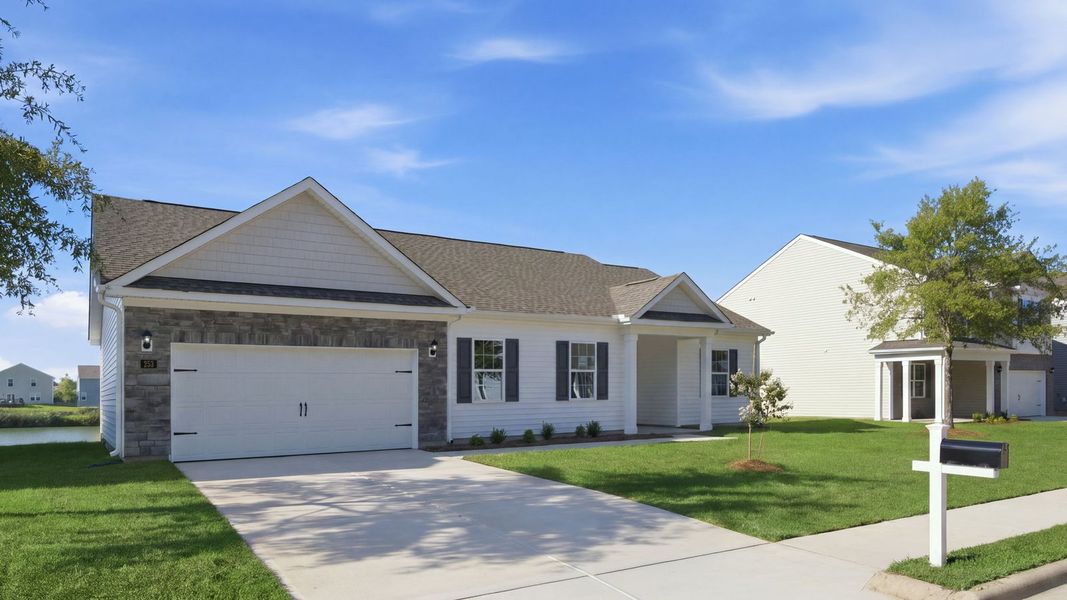 Front exterior of a new home in Tyler - Home on the Lake, New Bern, NC, highlighting curb appeal (Image 21).