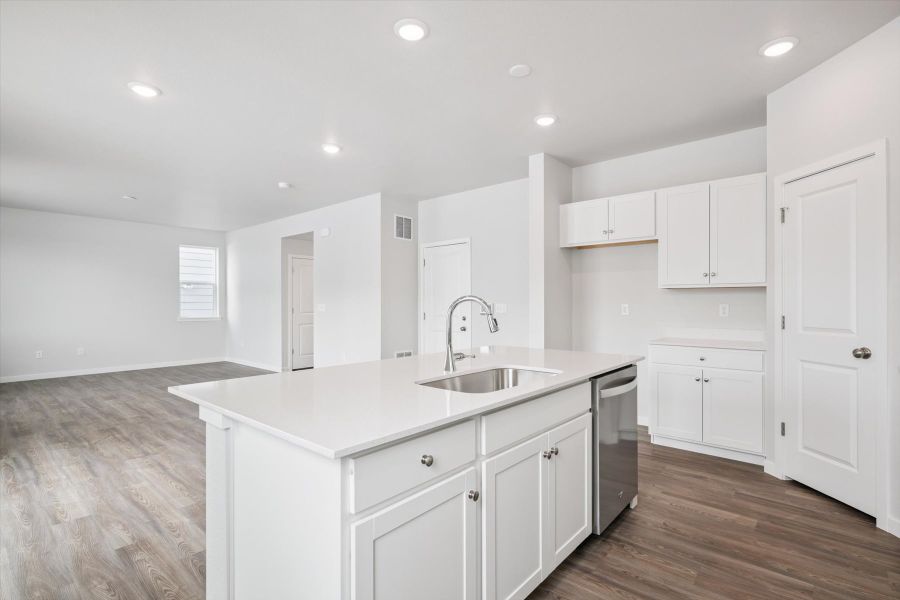 A kitchen with white cabinets. A kitchen with white cabinets.