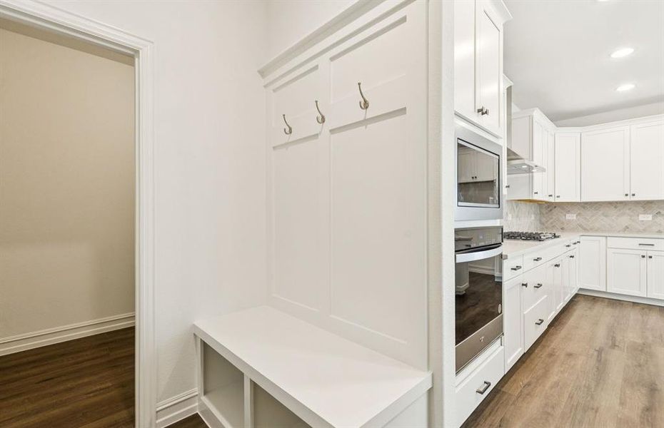 Mud bench at entry from garage Mud bench at entry from garage