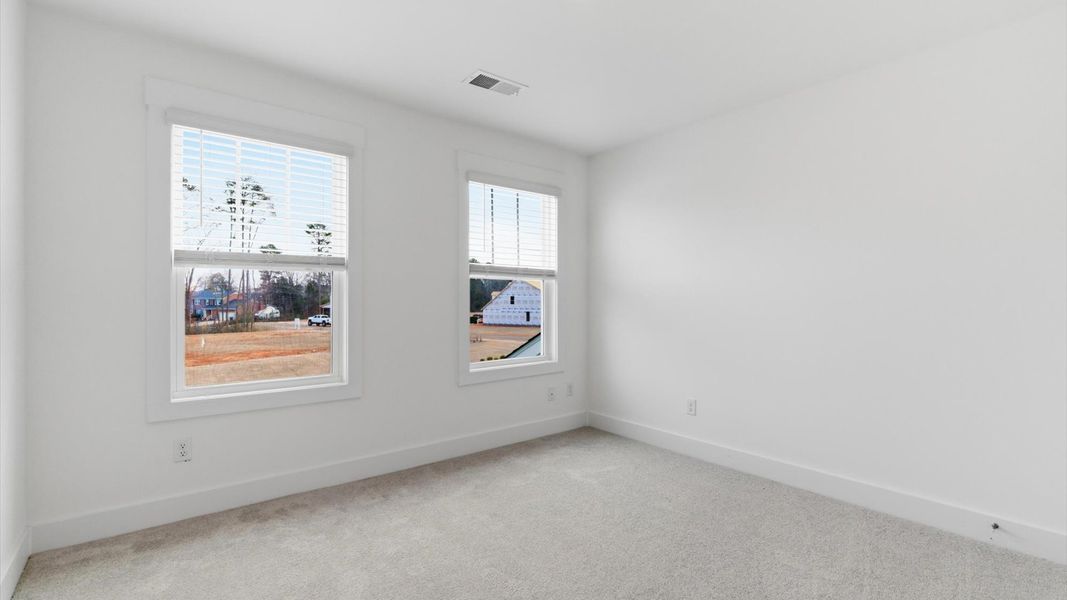 Memorable space offering plush carpet underfoot and a thoughtfully planned walk-in closet