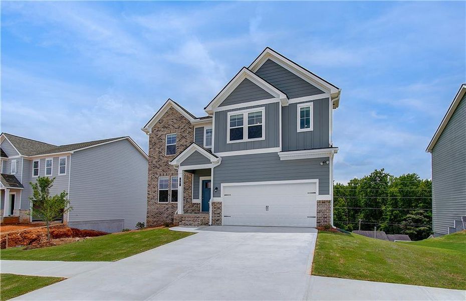 Front exterior of a new home in Chapel Hill, Newnan, GA, highlighting curb appeal (Image 2). Front exterior of a new home in Chapel Hill, Newnan, GA, highlighting curb appeal (Image 2).