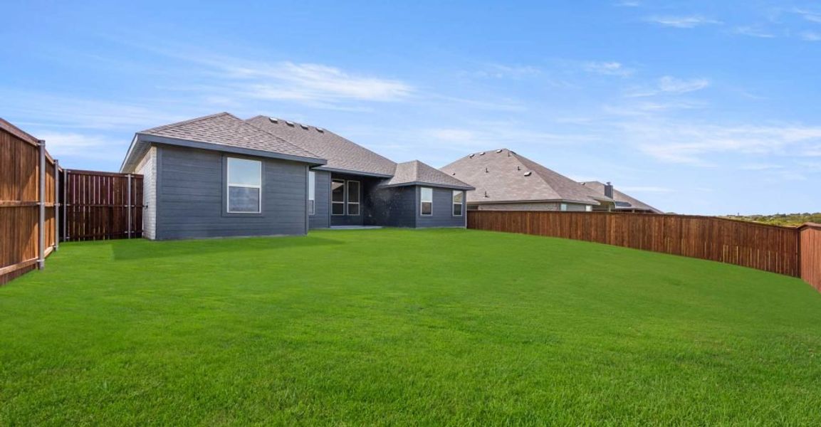 Representative exterior photo of a completed home built from the Alderbury by Impression Homes in Timberbrook, Justin, TX (Image 25).