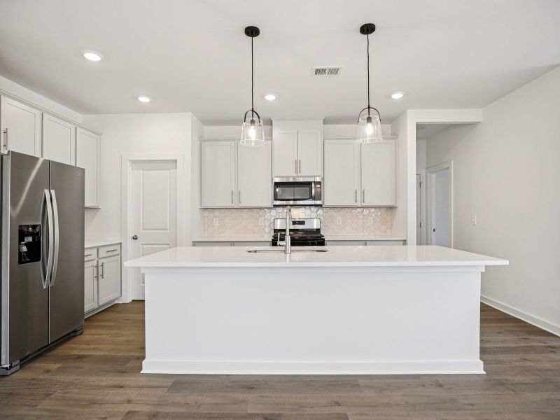 Prep dinner in the kitchen without missing the conversation in the great room.