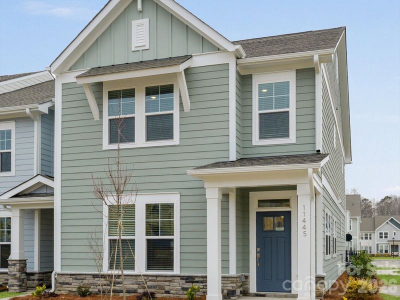 Front exterior of a new home in North Creek Village, Huntersville, NC, highlighting curb appeal (Image 17).