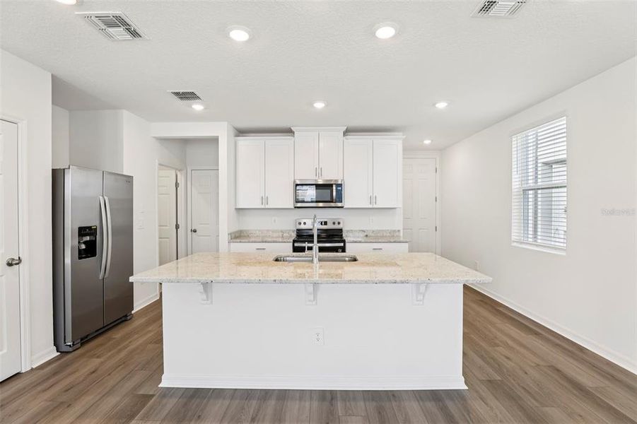 Furnished interior view inside a new home in The Meadow at Crossprairie Townes, St. Cloud (Image 10).
