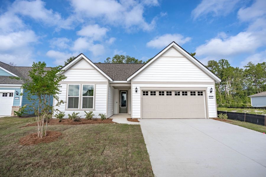 Front exterior of a new home in Del Webb Charleston at Nexton, Summerville, SC, highlighting curb appeal (Image 2). Front exterior of a new home in Del Webb Charleston at Nexton, Summerville, SC, highlighting curb appeal (Image 2).