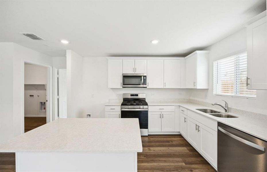 Spacious kitchen with eat-in bartop island