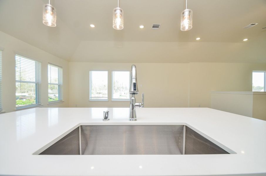 The stainless steel appliances offer a sleek and contemporary look.