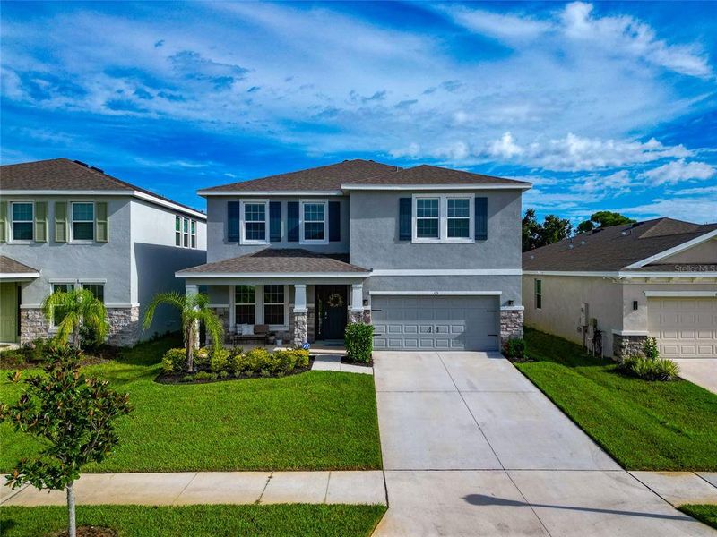 Front exterior of a new home in , Apollo Beach, FL, highlighting curb appeal (Image 33).