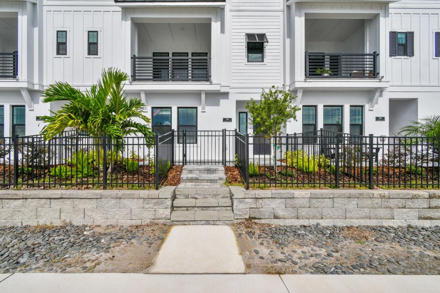 Exterior details and patio area of a home in Emerald Landing at Waterside at Lakewood Ranch – City Homes, Sarasota (Image 27).