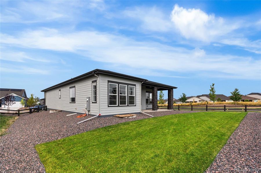 Front exterior of a new home in Hilltop at Inspiration, Aurora, CO, highlighting curb appeal (Image 22).