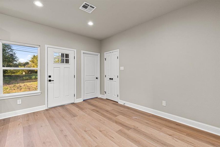 Foyer featuring light wood finished floors and recessed lighting Foyer featuring light wood finished floors and recessed lighting