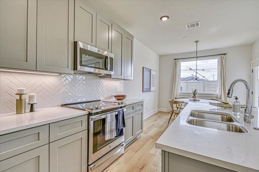 Furnished interior view inside a new home in Townhomes at Gattis, Round Rock (Image 9). Furnished interior view inside a new home in Townhomes at Gattis, Round Rock (Image 9).