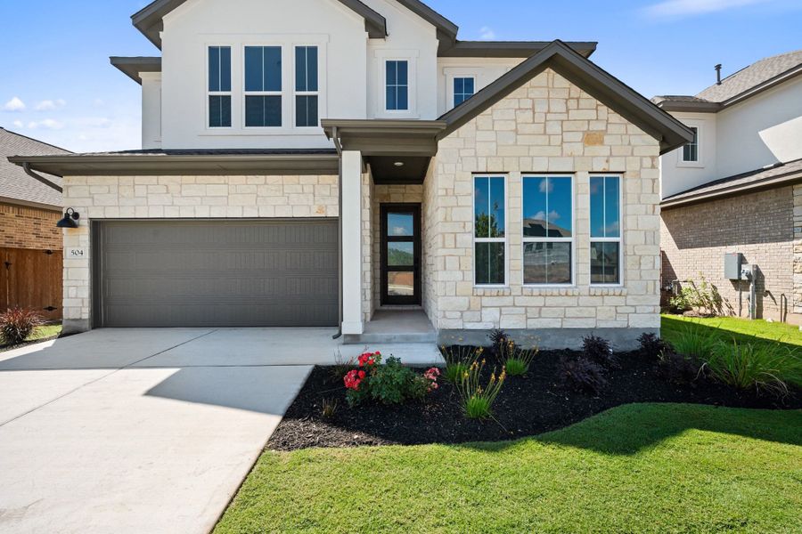 Front exterior of a new home in Lariat, Liberty Hill, TX, highlighting curb appeal (Image 25).