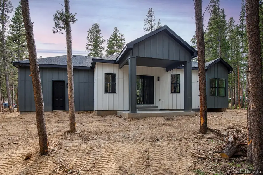 Front exterior of a new home in , Idaho Springs, CO, highlighting curb appeal (Image 1).