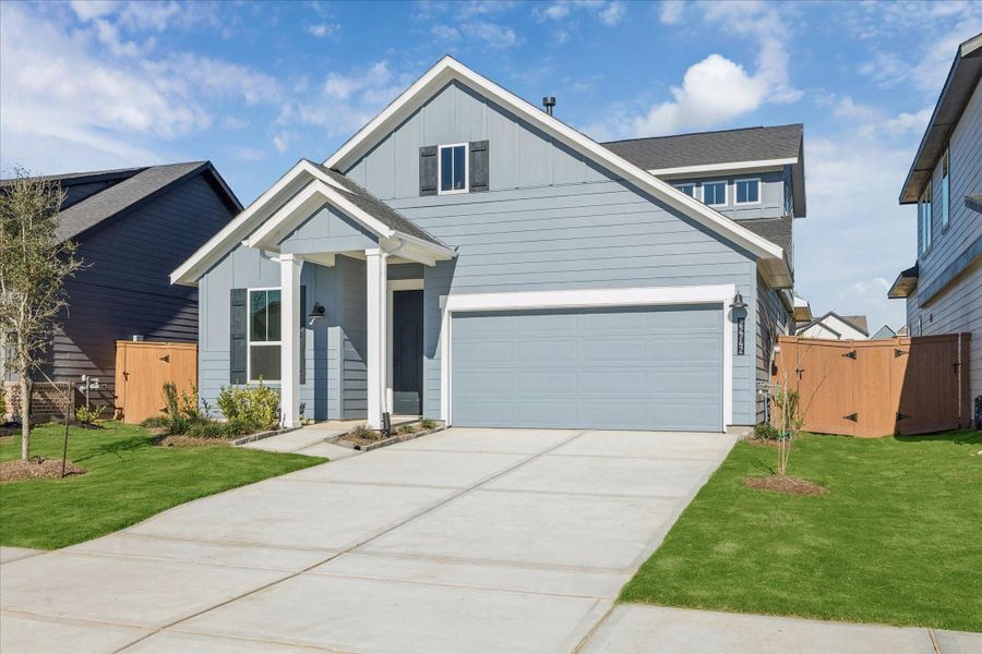 Front exterior of a new home in Elyson, Katy, TX, highlighting curb appeal (Image 20).