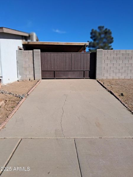 Side parking with gate to covered patio